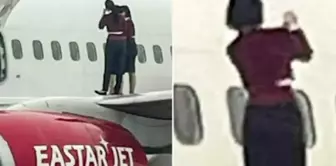 The flight attendants opened the emergency exit door and took a selfie on the wing of the plane.