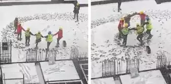 Construction workers danced the horon under the snow.