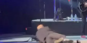 The famous singer fell to the ground after throwing the microphone to the fans on stage.