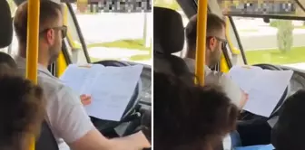 The minibus driver studied while driving.