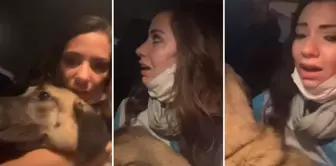She escaped from the flames like this with the dog in her arms.