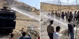 Reflections of the new era: Water cannons are now spraying water on the pavement.