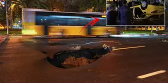 Due to heavy rain in Istanbul, the road collapsed, and a taxi that fell into the pit overturned.