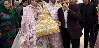 At the wedding, they dressed the bride and groom in vests made of money and placed crowns on their heads.