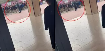 صورة تثير الانفعال! مدير المدرسة ألقى الطالب الذي أمسكه من ياقة قميصه على الأرض.