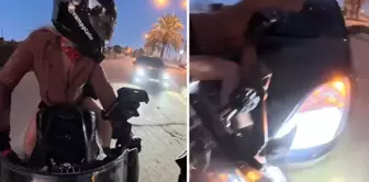 The woman motorcyclist was hit by a car coming from behind.