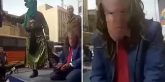 A scene to anger Trump in Iran: They brought him on stage and beheaded him.