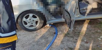 A dead body was found in a parked car.