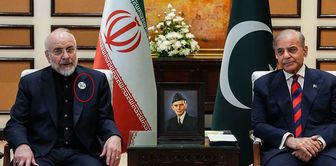 The head of the Iranian delegation did not forget! The striking badge detail.