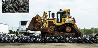 Over 200 illegal motorcycles were destroyed by being crushed with a bulldozer.