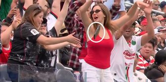 The woman doing the Mexican wave experienced the shock of her life as a result of a moment of inattention.