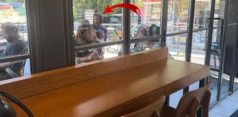 Nathan Ake's appearance at the coffee shop caused a stir! The person across from him is a topic of curiosity.