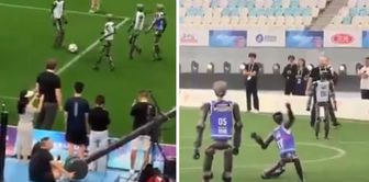 Robots landed on the green field! A fiercely contested football match.