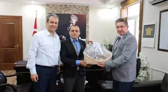 Nto Başkanı Arslan, Bozdoğan Kaymakamı Can'a 'Uzun Yaşam Sepeti' Hediye Etti