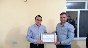 Kaymakamdan Muhtar Taşan'a plaket