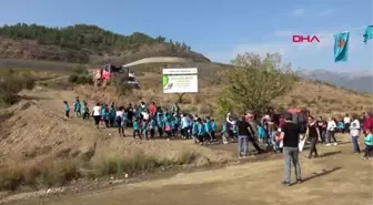 Alaköprü barajı'nda fidanlar toprakla buluşturuldu