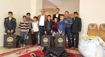 Başkan Benek'ten öğrencilere kışlık bot ve mont yardımı