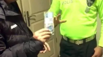 Polis yerde bulduğu 10 bin TL'yi yaka kamerası sayesinde sahibine ulaştırdı