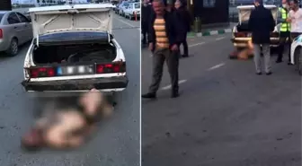 Dövüp soydukları adamı otomobilin bagajından atarken polise yakalandılar