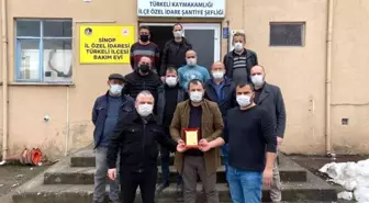Türkeli MHP'den emekçilere 'teşekkür' plaketi