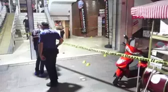 TARTIŞTIĞI KİŞİYİ SOKAK ORTASINDA BACAKLARINDAN VURDU