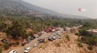 İki orman işçisinin hayatını kaybettiği mahallede alevleri söndürmek için havadan karadan mücadele devam ediyor
