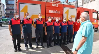 Antalya'da yangın söndürme çalışmalarını tamamlayan itfaiyeciler Ereğli'de çiçeklerle karşılandı