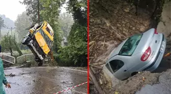 Çöken yola düşen iki araçtaki 12 kişi, sel sularına kapılmaktan son kurtuldu