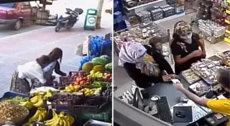 Anne ve çocuk marketin önündeki tezgahtan nar ve üzüm çaldı