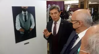 İYİ HAL İNDİRİMİNİ ELİ SİLAHLI TAKIM ELBİSE VE KRAVATLI FOTOĞRAFLARLA ANLATTILAR