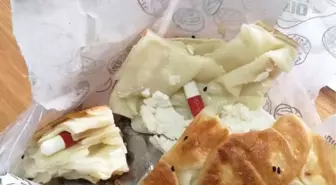 Gözaltındaki akrabasına börek içinde uyuşturucu getirdi