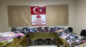 Karacabey'de kadınlar depremzedeler için eşofman ve pijama takımı dikiyor