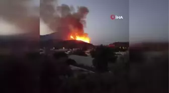 Seydikemer'deki yangın makilik alanda devam ediyor