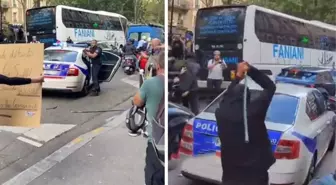 Fransa'da göstericiler polis aracına saldırdı, memur silah çekerek kalabalığı dağıttı