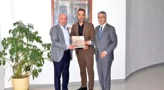 MHP Erzurum Milletvekili Prof. Dr. Kamil Aydın Erzurum Ticaret ve Sanayi Odası Başkanı Saim Özakalın'ı ziyaret etti