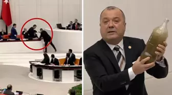 Meclis'te tansiyon yükseldi! Bakan Kurum, CHP'li vekilin getirdiği pis suyu yere fırlattı