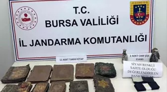 Bursa'da Tarihi Eser Operasyonu: Altın Yazmalı Kitaplar ve Sahte Dolarlar Ele Geçirildi