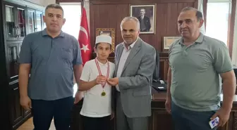 Mikail Çetinkaya'dan Örnek Davranış: Kazandığı Altını Filistinli Çocuklara Bağışladı
