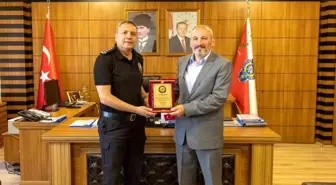 Emekli Polis Memuru Alişan Aksoy'a Plaket Töreni