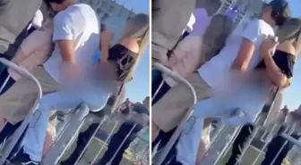 Konserde kız arkadaşına sarılırken arkasındaki kadını taciz etti