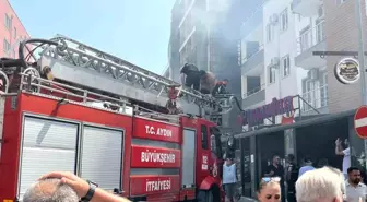 Kuşadası'nda Yangın Paniği: Mahsur Kalan Vatandaş Kurtarıldı