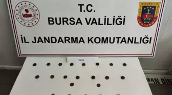 İnegöl'de Tarihi Eser Kaçakçılığı Operasyonu: 22 Sikke Ele Geçirildi