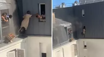 Kahraman kapıcı, yanan binanın 6. katından dört bebeği canını hiçe sayarak kurtardı
