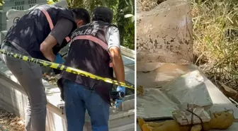 Mezarda bal mumundan yapılmış bebek ve bebeğe sarılı muska bulundu