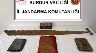 Bucak'ta Jandarma Kültürel Mirası Koruyor: 3 El Yapımı Kitap ve Tarihi Eser Ele Geçirildi