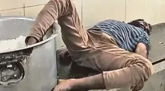 Öğrenci yurdunda çalışan sarhoş bekçi ayağı pirinç kazanı içinde uyurken yakalandı