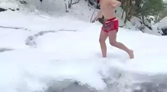 Karda şortla gezip şelale altında antrenman yaptı