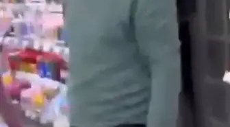 Kırtasiyede genç kızın fotoğrafını çeken şüpheliye tepki