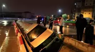 Kanala uçan otomobilin sürücüsü kazayı yara almadan atlattı