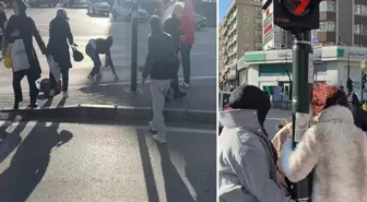 Fırtınada zor anlar: Uçmamak için trafik direğine tutundular